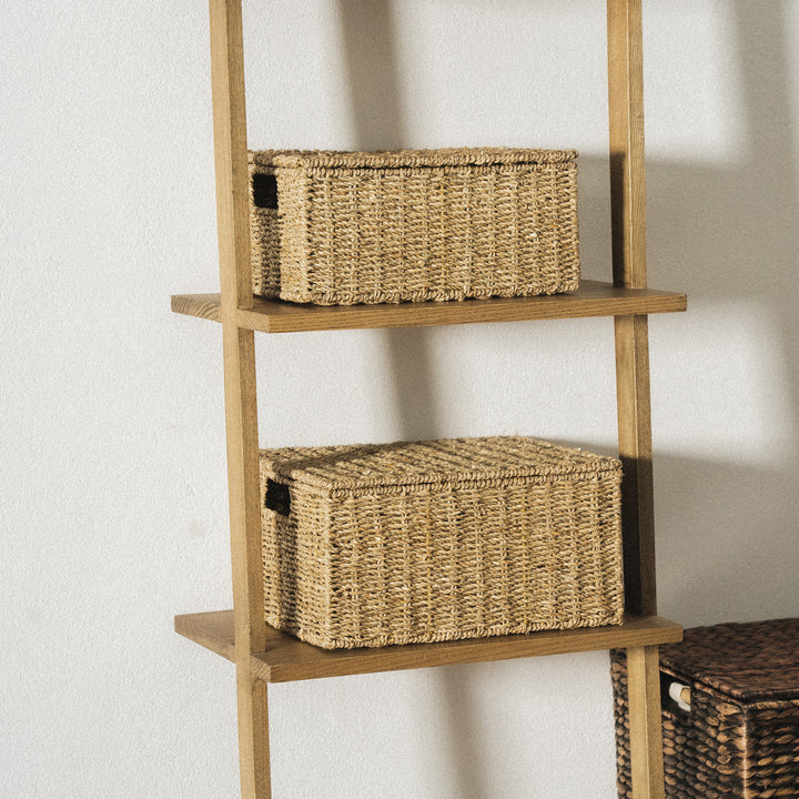 Seagrass-woven-storage-baskets-with-lids-placed-on-the-shelves-of-a-wooden-ladder-are-practical-and-aesthetically-pleasing