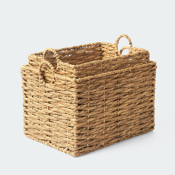 Two rectangle water hyacinth wicker baskets are stacking up