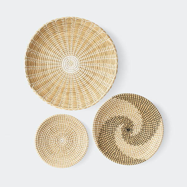 Handcrafted woven wall baskets with simple, elegant patterns