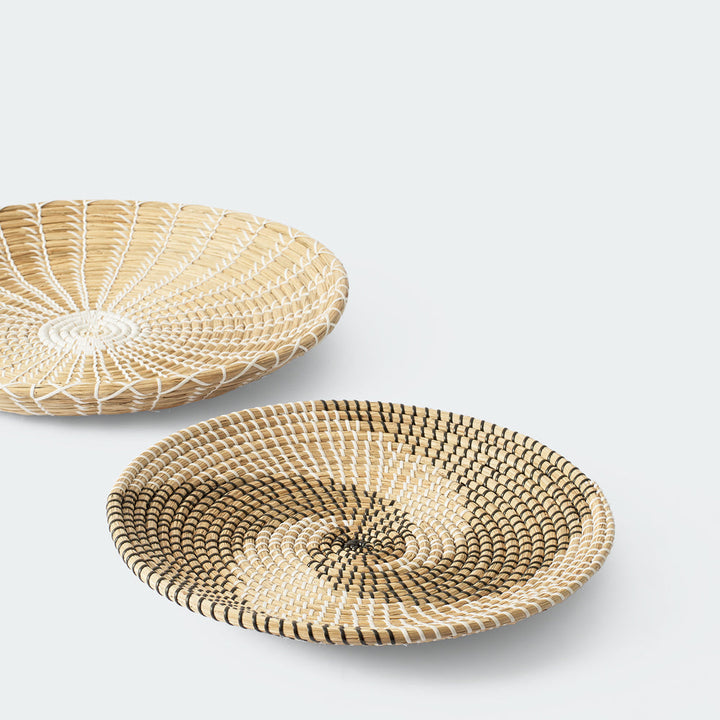 Handcrafted woven wall baskets with simple, elegant patterns