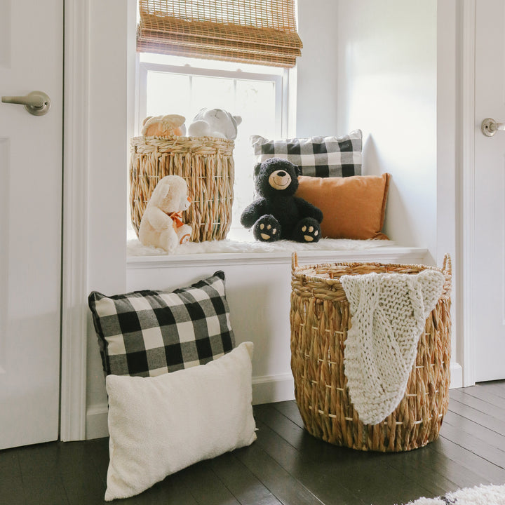 Large twisted water hyacinth wicker baskets filled with blankets