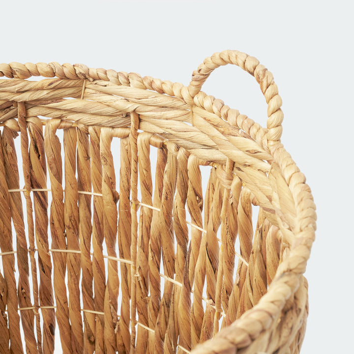 A view inside the cylindrical wicker basket, showing the neat, vertical weaving pattern and the sturdy structure