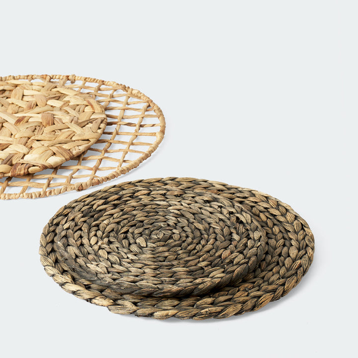 Three water hyacinth wall decor baskets with beige and brown tones