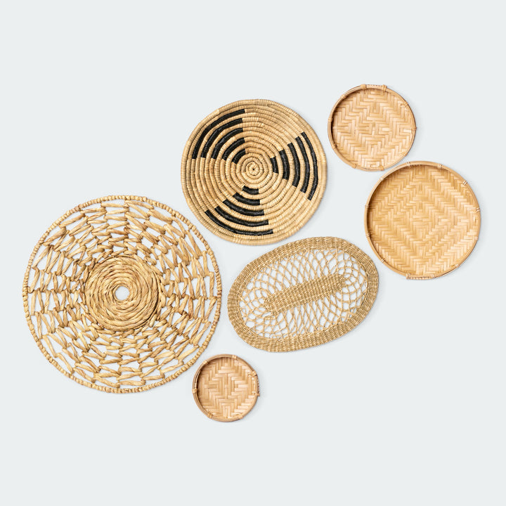 A set of six woven wall baskets in various shapes and sizes by Vietnamese artisans from Artera Home