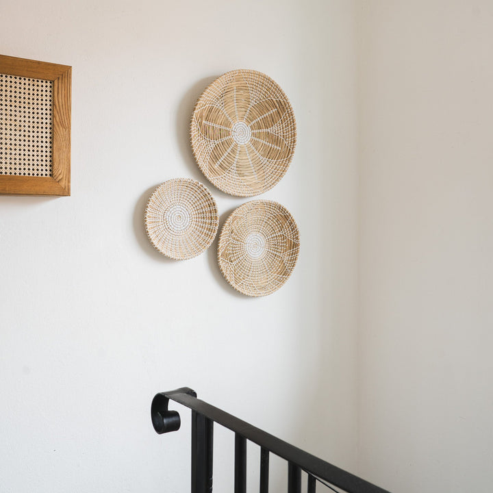 Artera Home round seagrass wall basket decor set of 3 with a white floral pattern