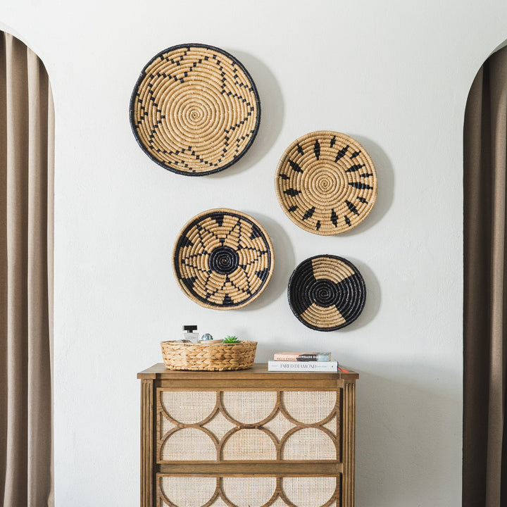 Geometric-seagrass-woven-wall-decor-displayed-above-a-wooden-dresser-highlighting-their-intricate-patterns-and-natural-beauty