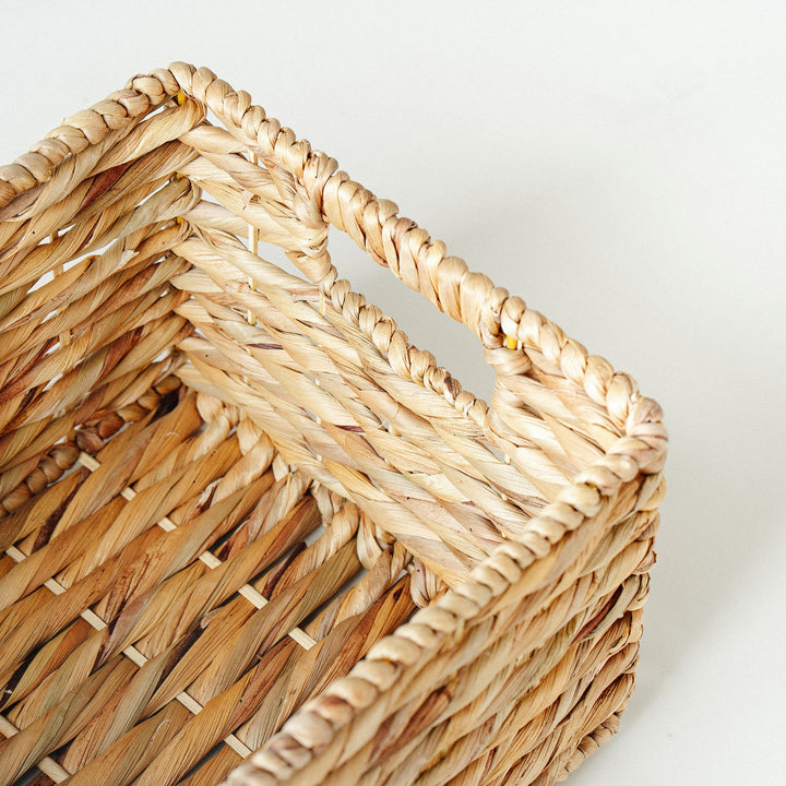 Detailed twisted weaving lines of a rectangular water hyacinth wicker basket