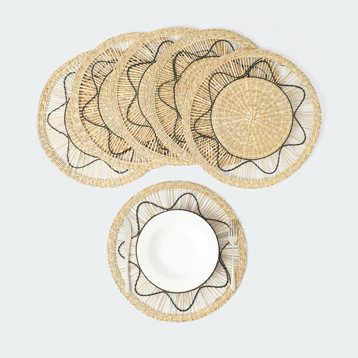 Set of 6 round wicker placemats with black sun-like thread design