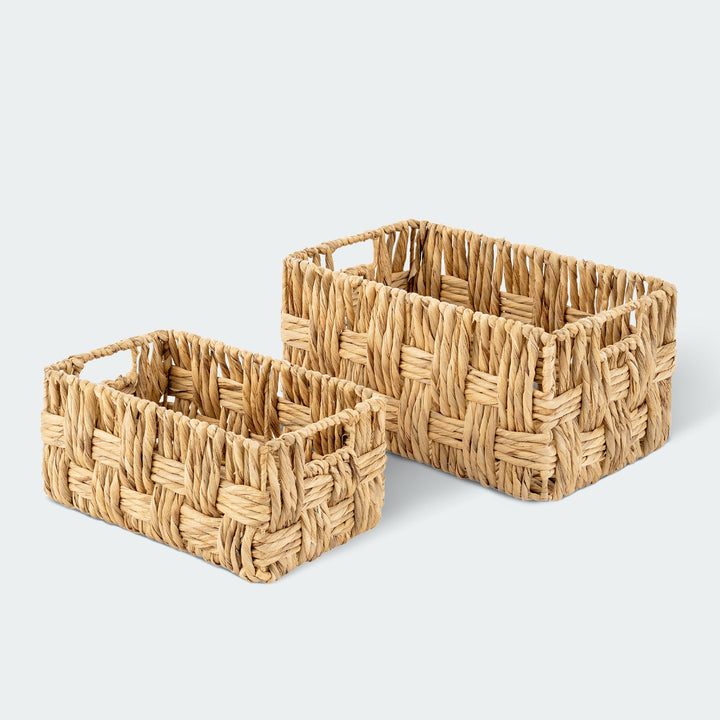 Small wicker storage basket set with books and kitchen items from Artera Home
