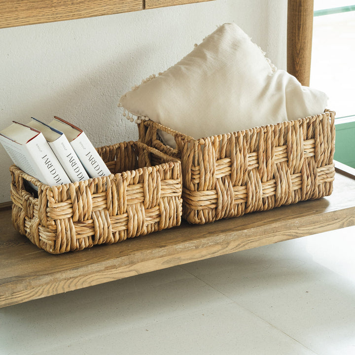 Small wicker storage basket set with books and kitchen items from Artera Home