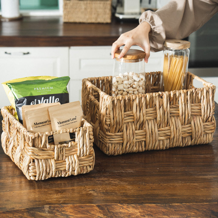 Small wicker storage basket set with books and kitchen items from Artera Home