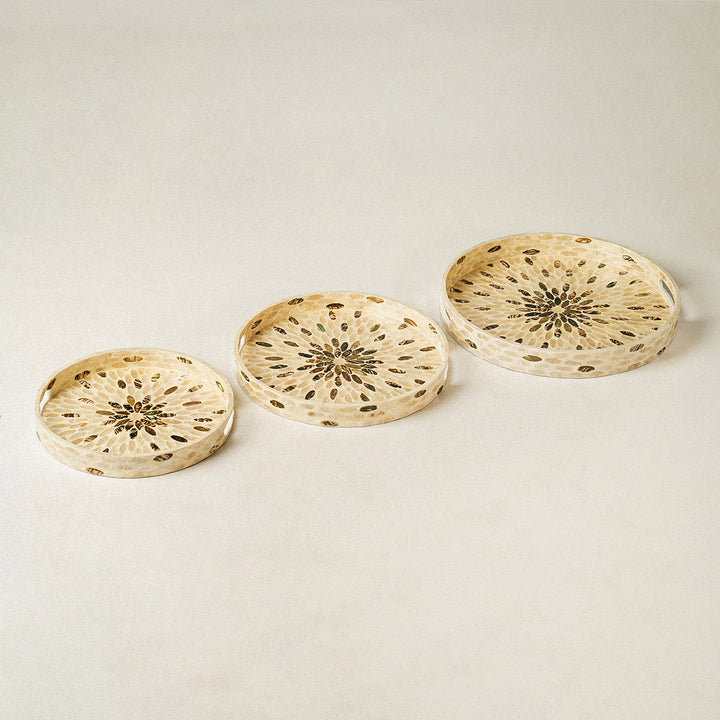 3-floral-mother-of-pearl-wicker-serving-trays-are-arranged-in-a-row